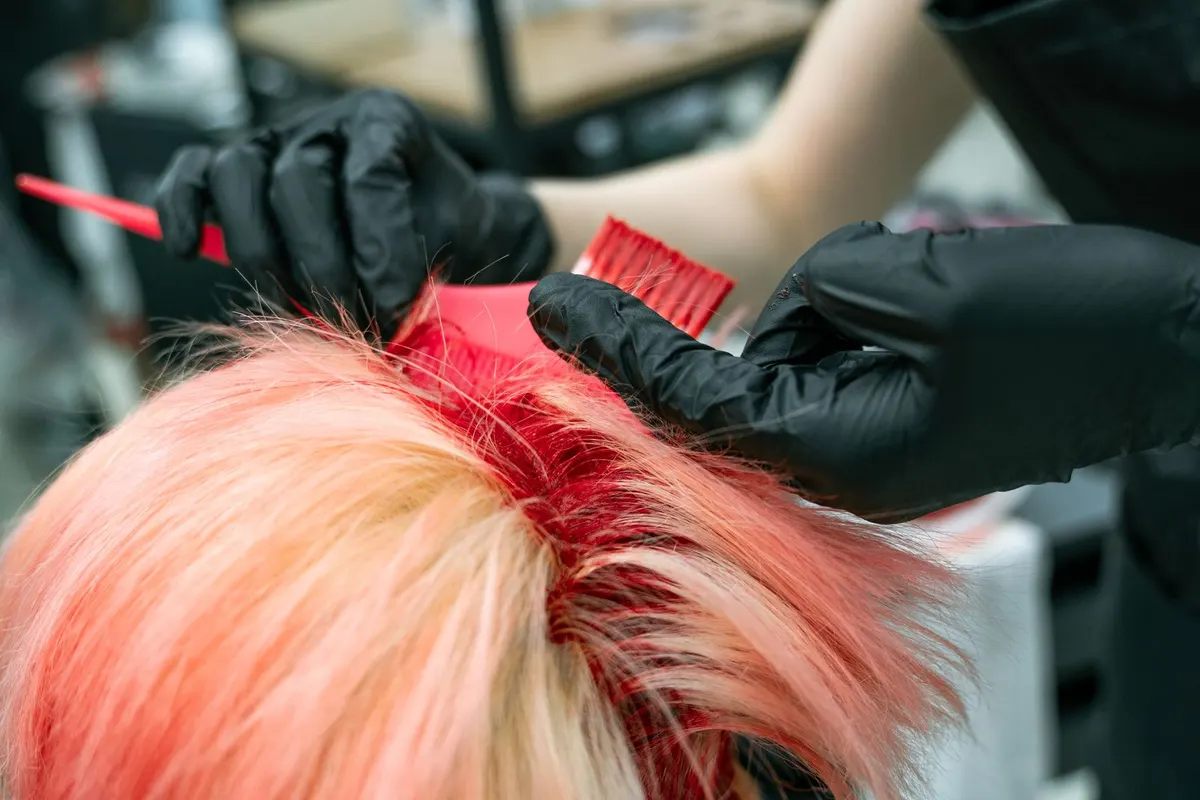 Hair color being applied with a brush