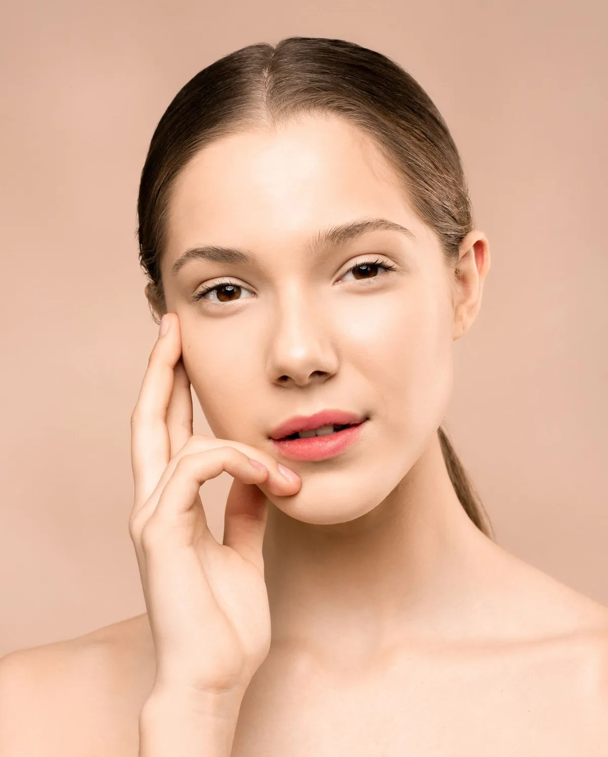 Client with softly shaped brows and glowing skin