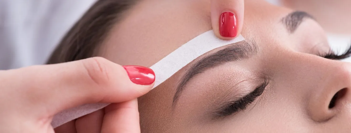 Brow waxing with a strip